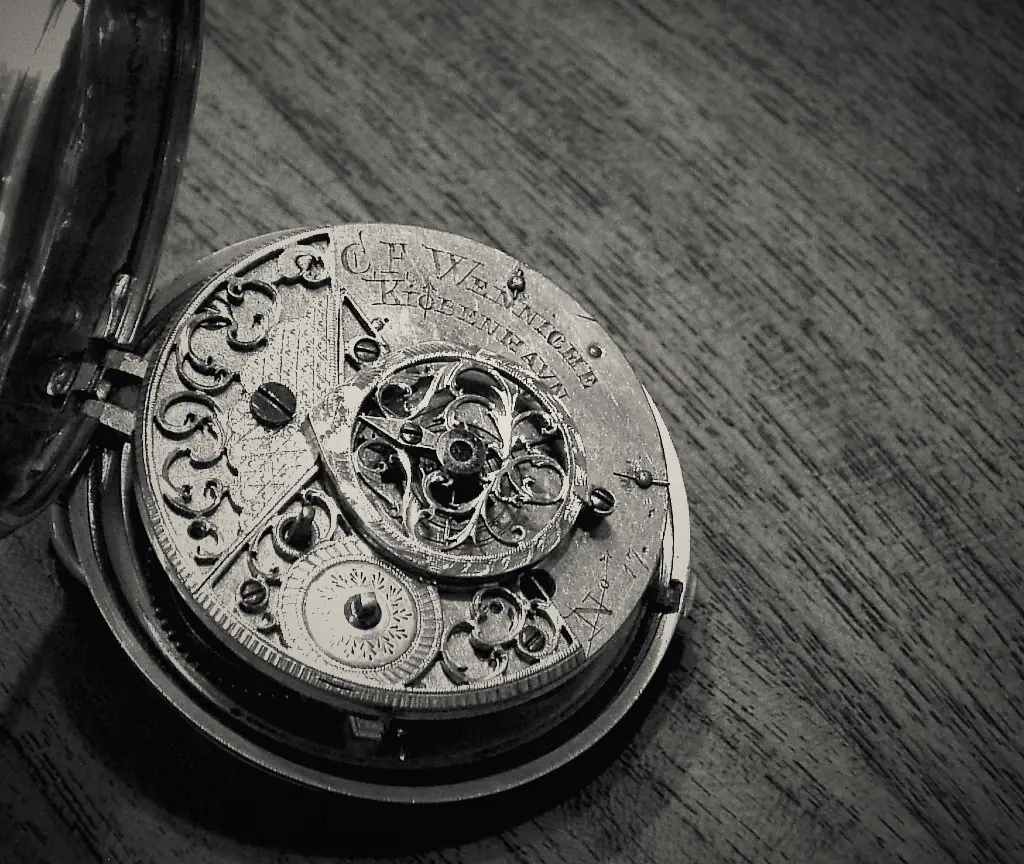 Hand engraving across the bridges of a gilt movement.