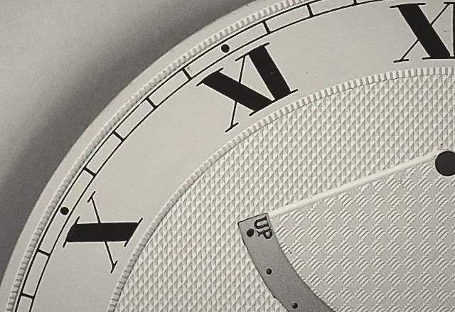 Engine-turned guilloché, cut in concentric waves across a dial.