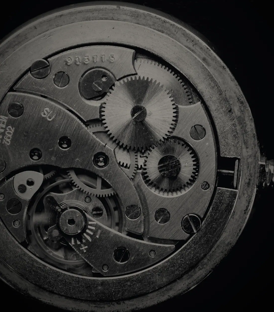 V-01 NOCTURNE: a movement in black ceramic, lit from a single side.